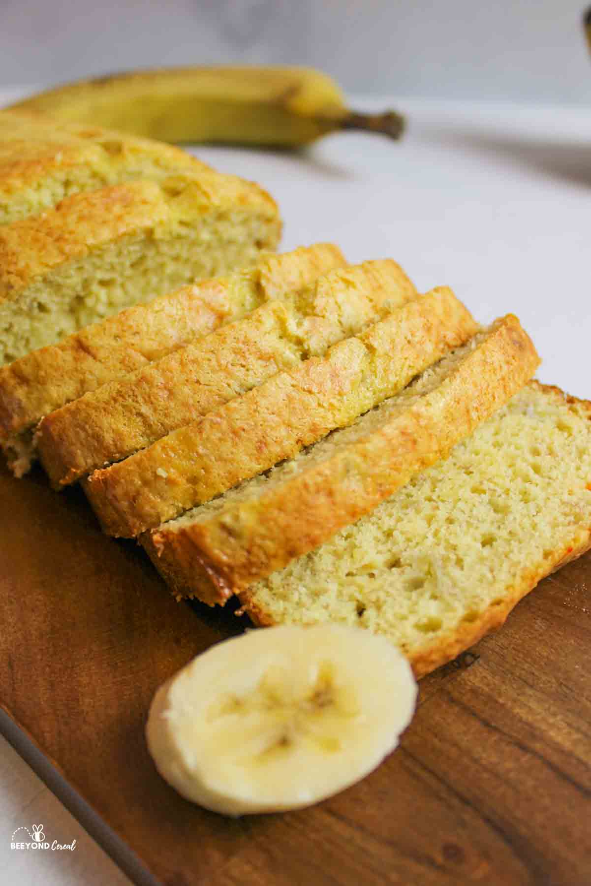 sliced banana bread loaf and muffins of various sizes.