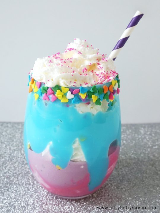 a glass full of unicorn milkshake