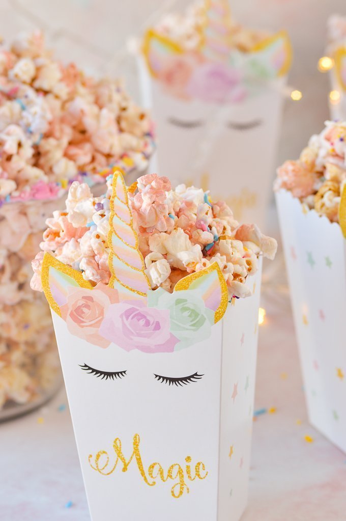 unicorn popcorn in a unicorn bo with the word magic written on it