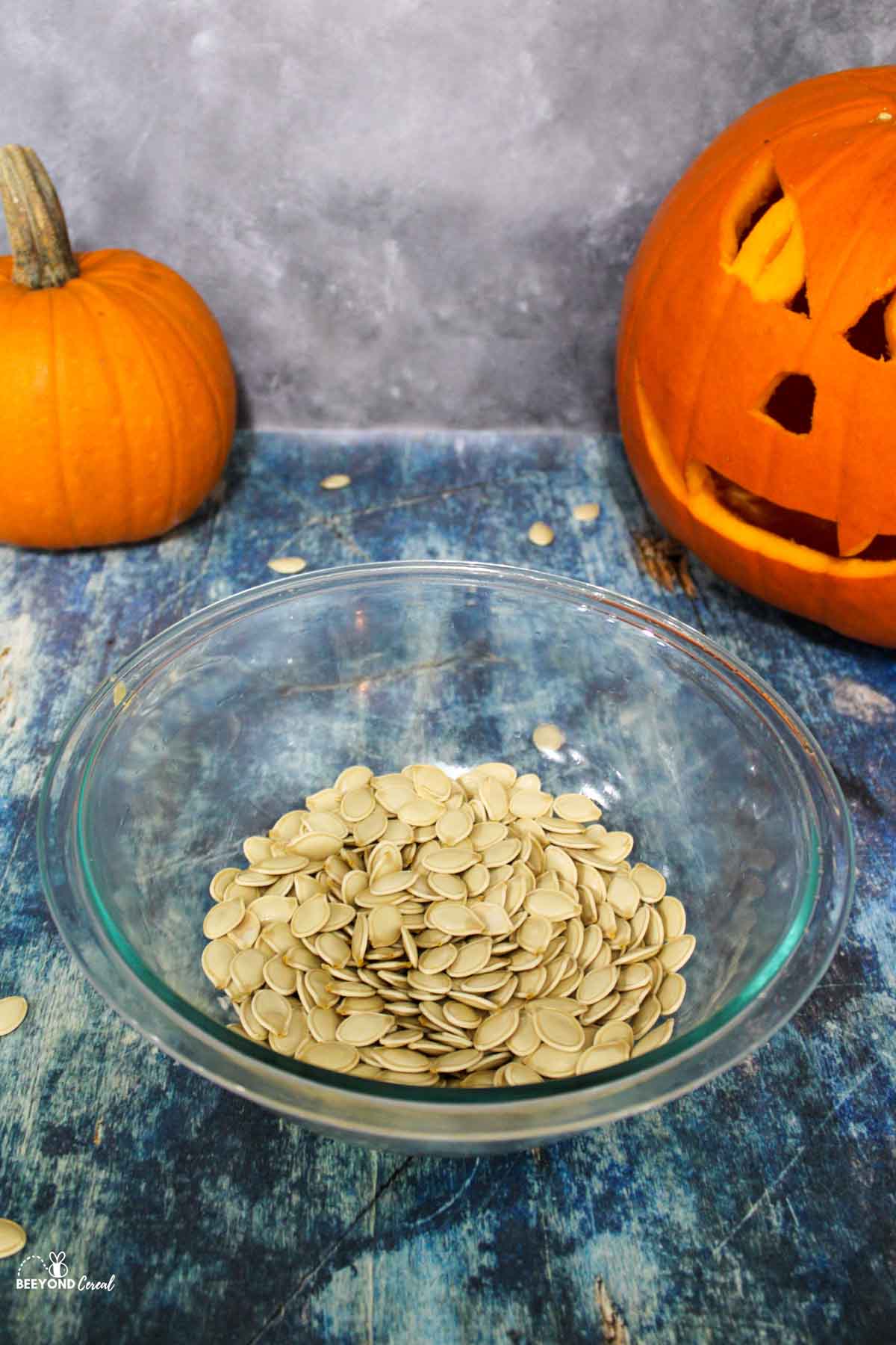 cleaned and dried pumpkin seeds in a glass bowl
