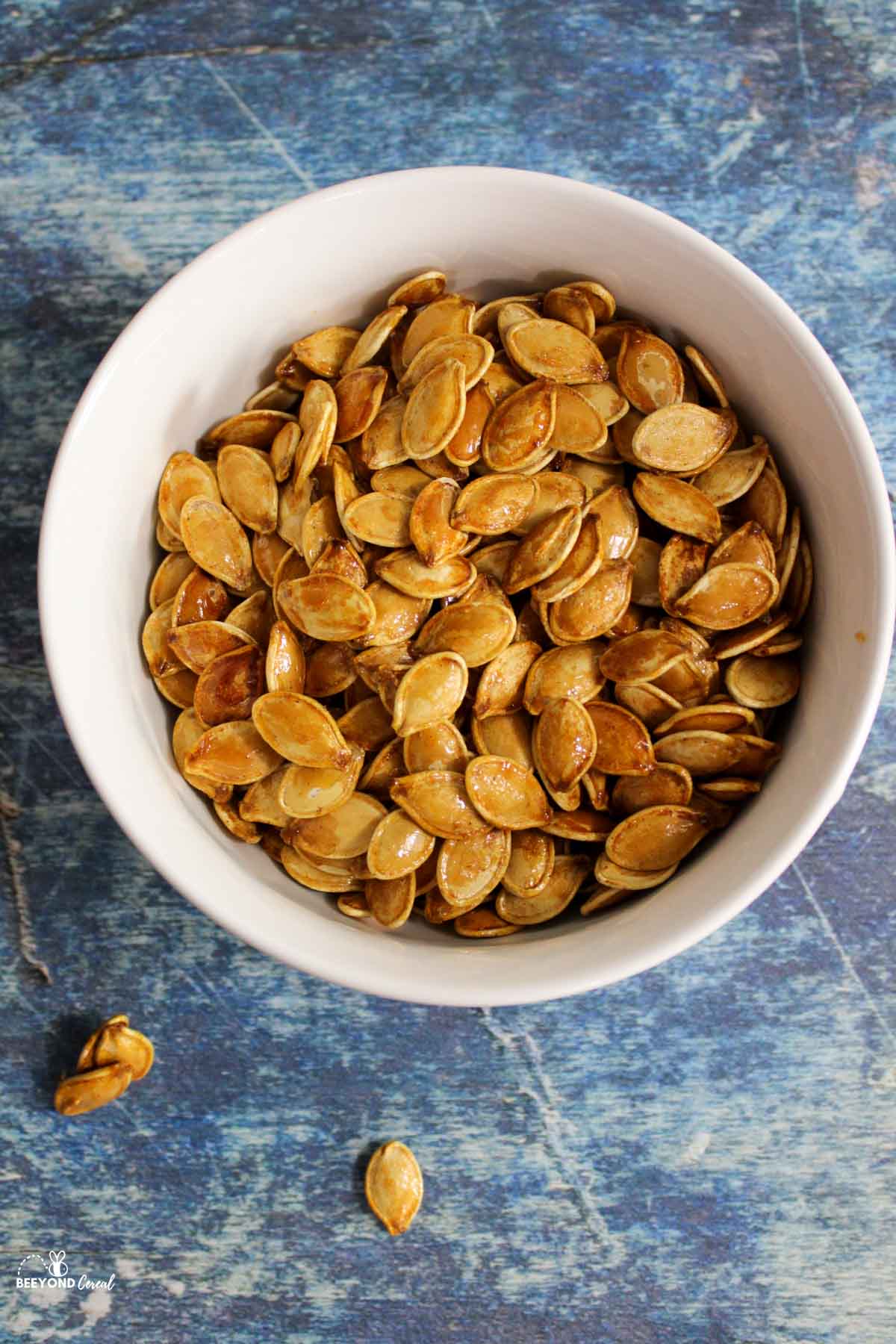 a bowl filled with honey roasted pumpkin seeds