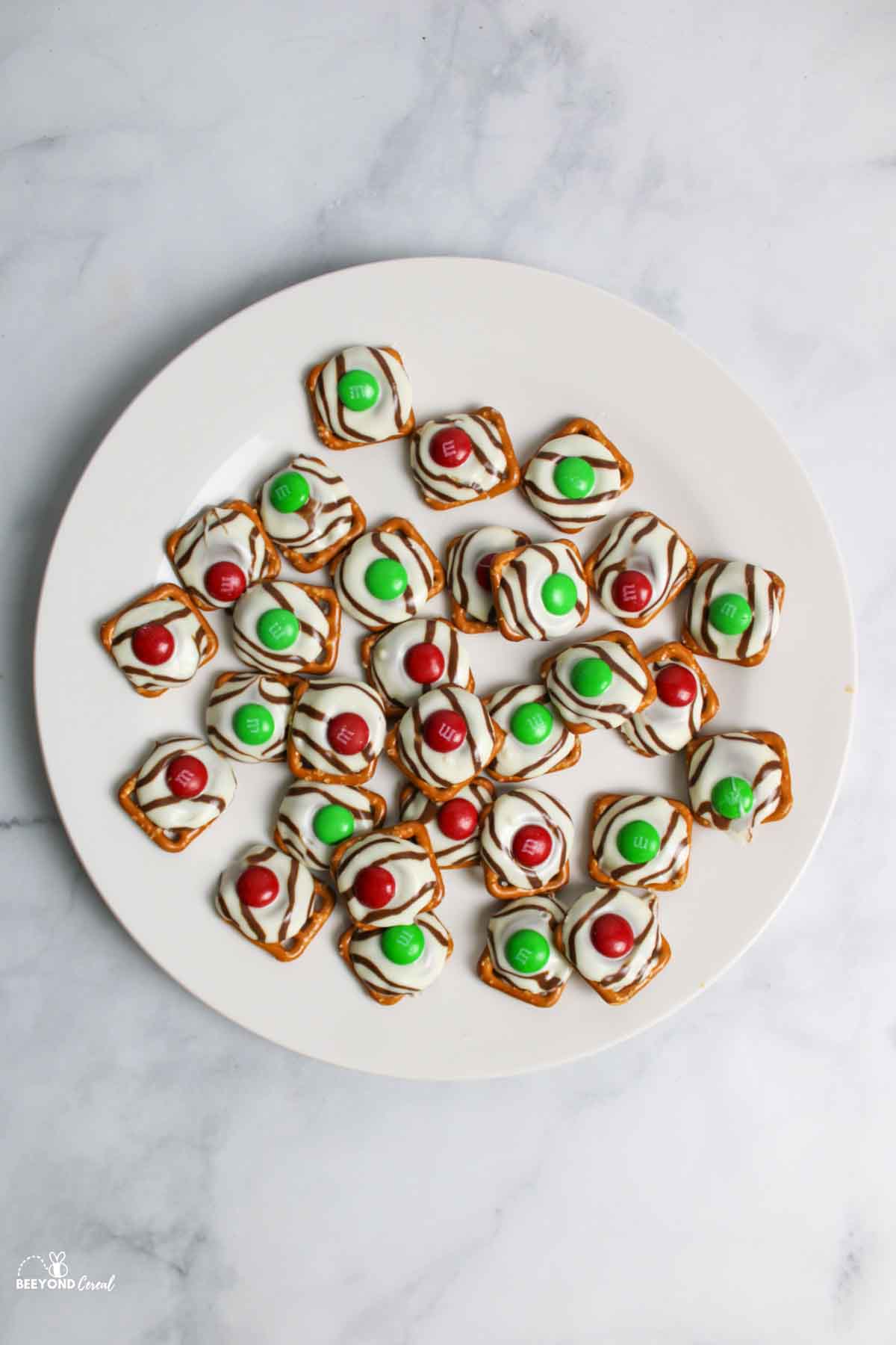 aerial view of christmas pretzels on white plate