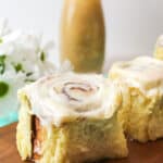 a cinnamon roll with a bite on a fork