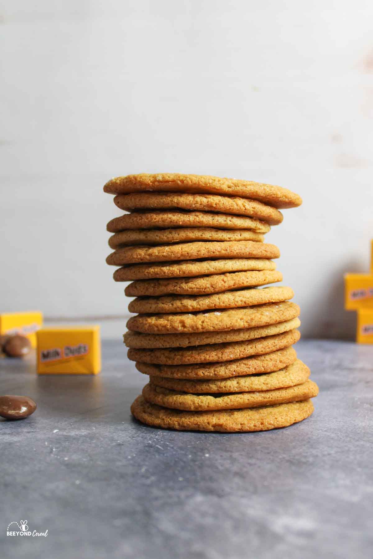 a stack of thin milk dud stuffed cookies