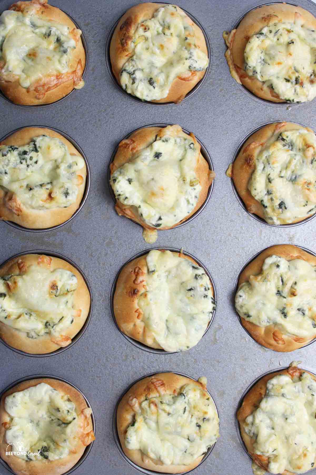 spinach dip bowls in a muffin pan.