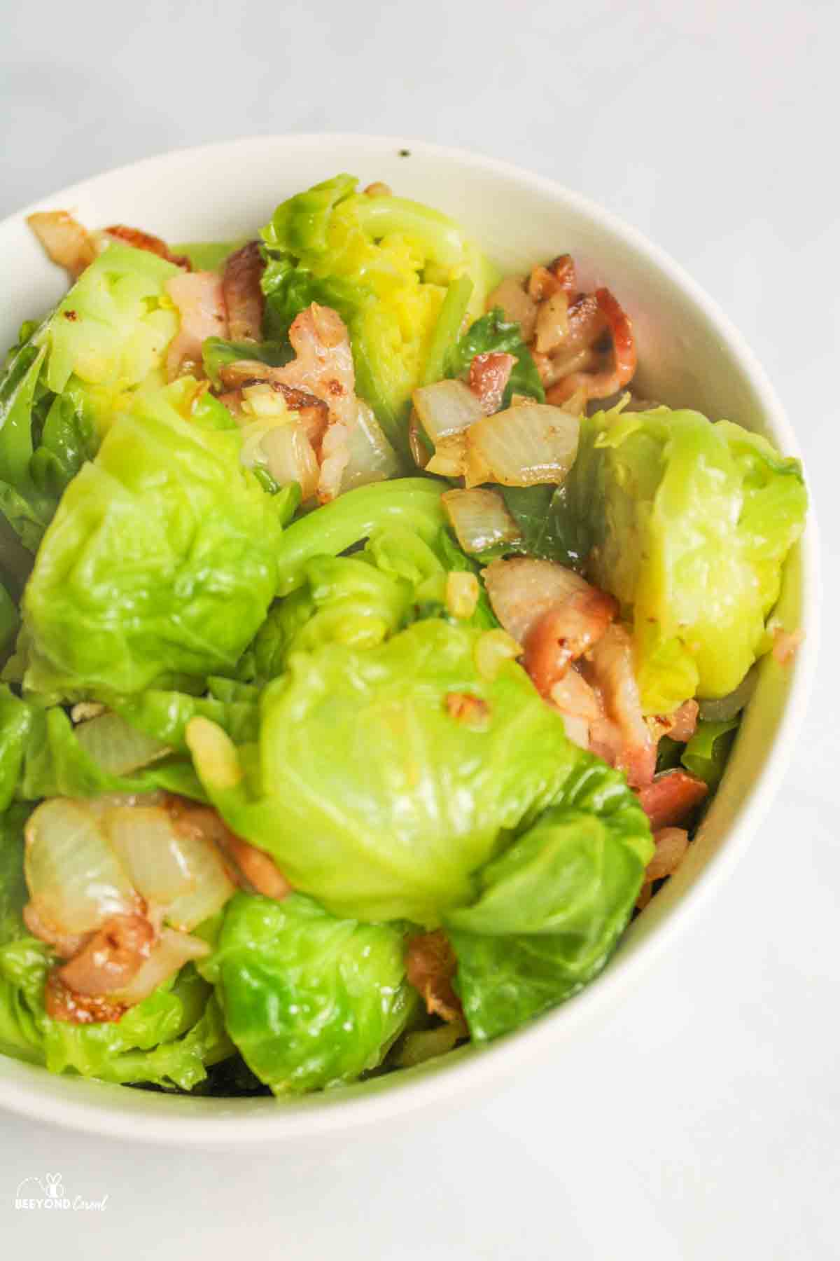 up close aerial view of bacon and brussel sprouts in a bowl