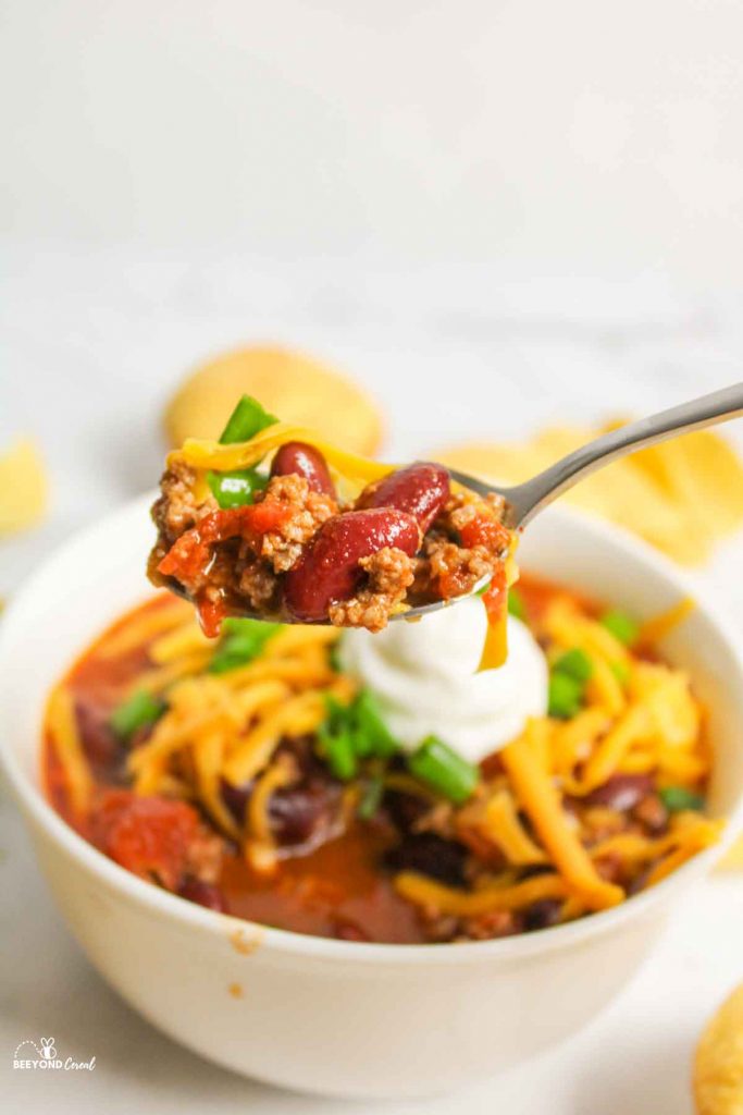 spoon holding up bite of chili