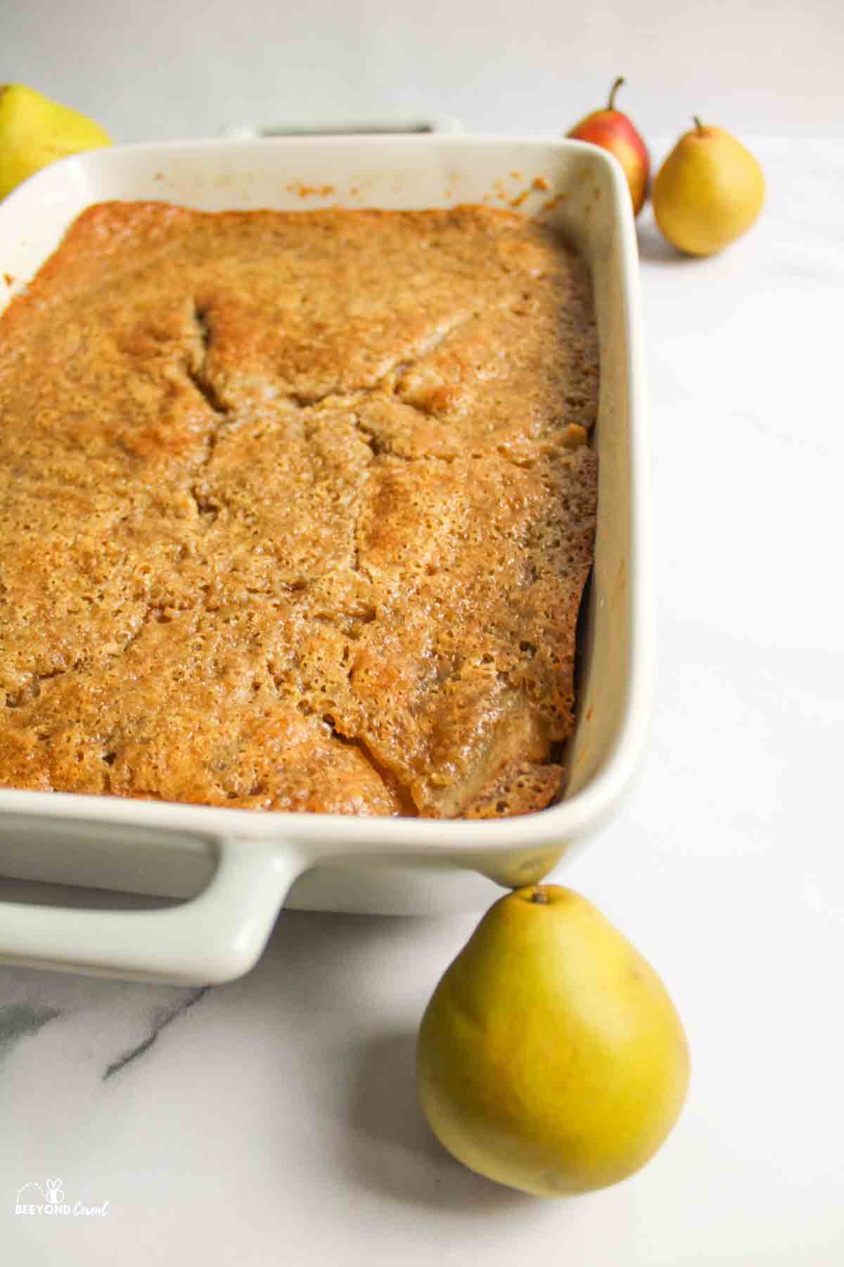 baked pear cobbler near fresh pears.