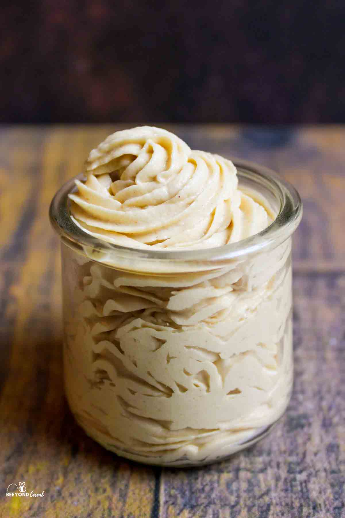 peanut butter cream cheese frosting in a small glass jar.