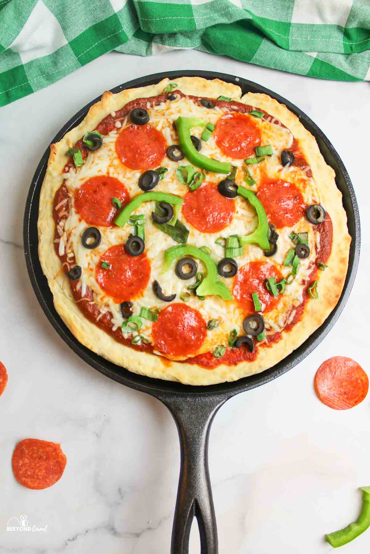 baked pizza on a cast iron griddle.
