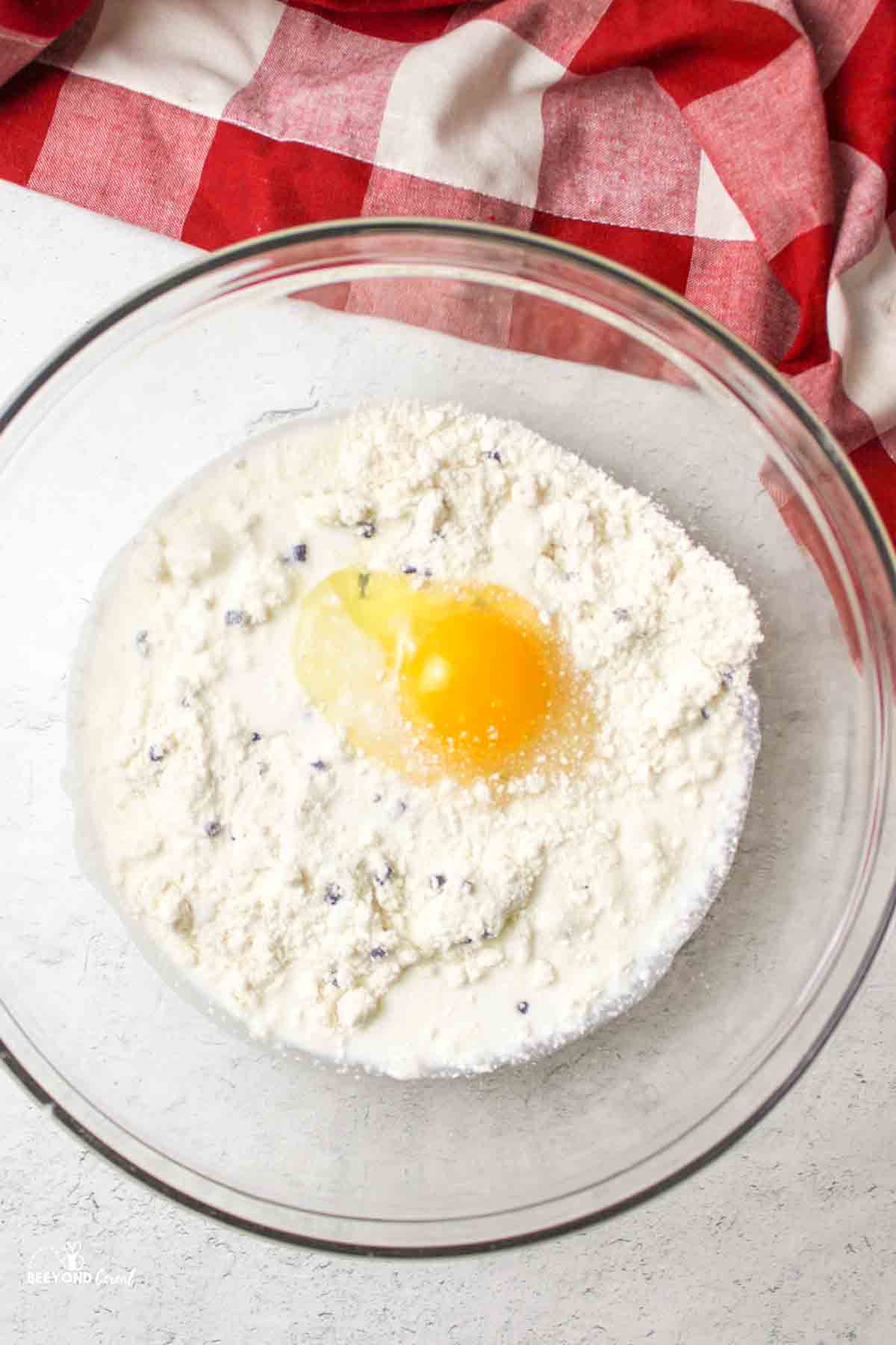 muffin mix, egg, and milk in a mixing bowl