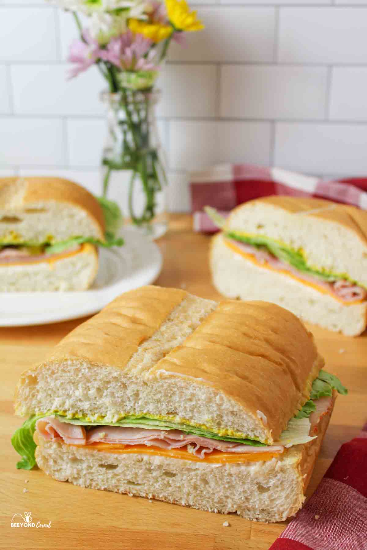 three cut pieces of a giant sub sandwich.