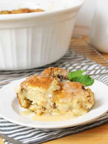 a glazed slice of bread pudding on a plate.