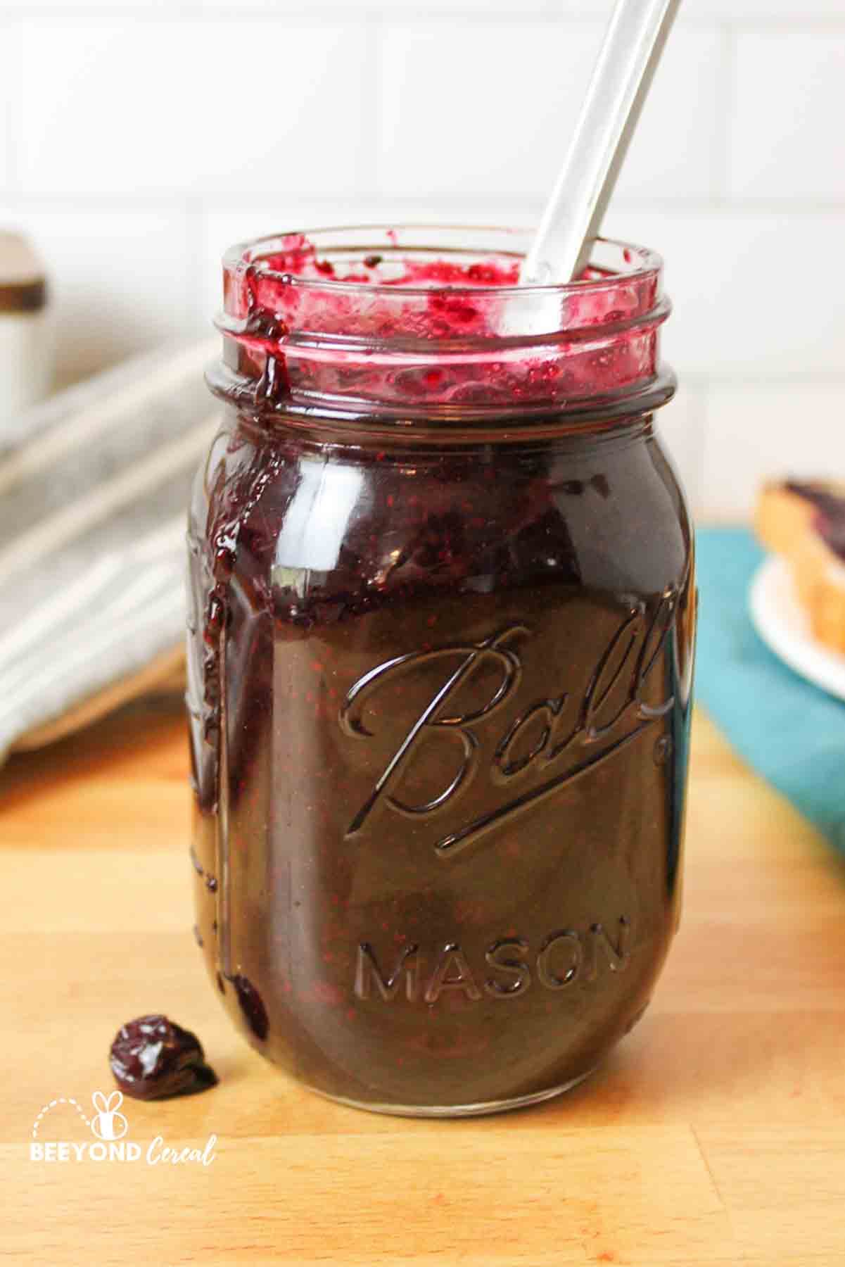 Jar filled with sugar-free blueberry jam, with jam mess.