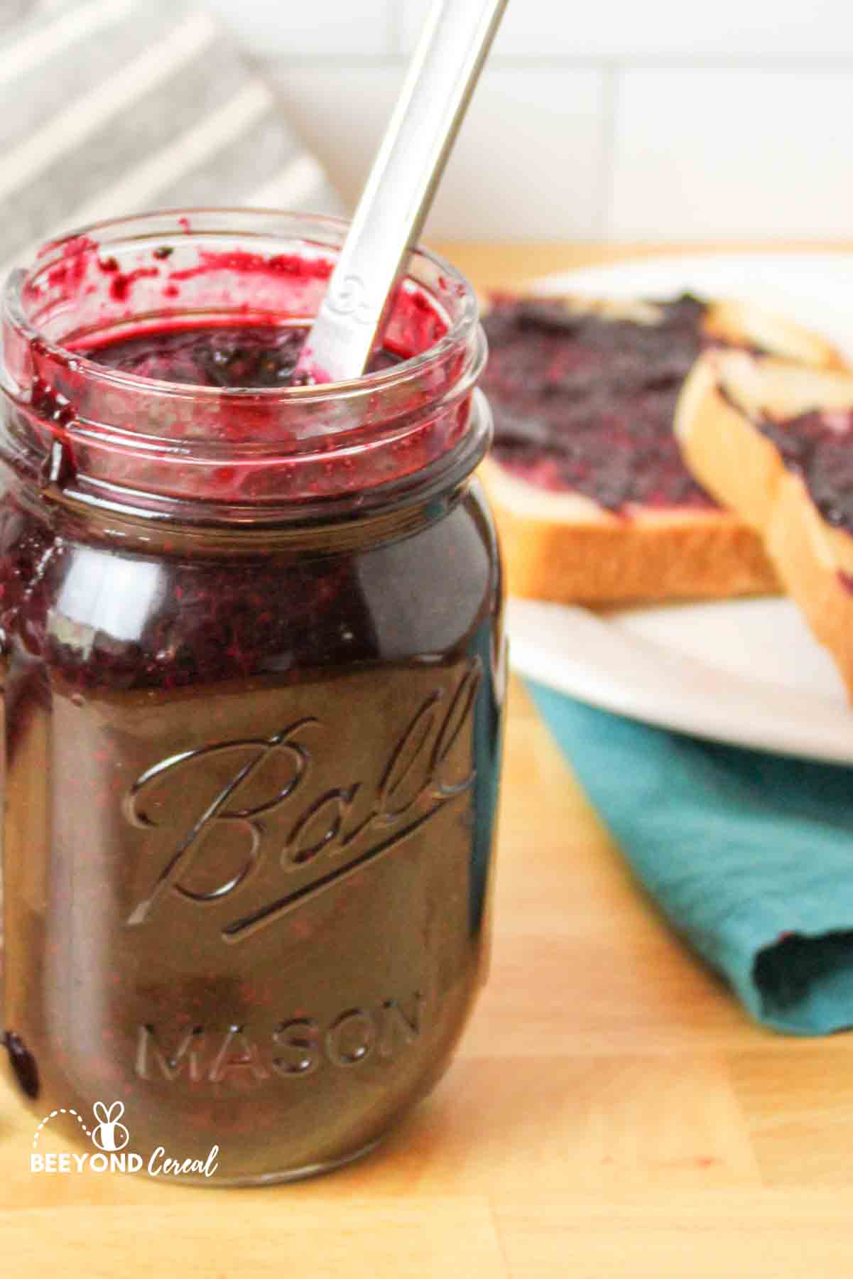 a side view of a jar filled with sugar free blueberry jam