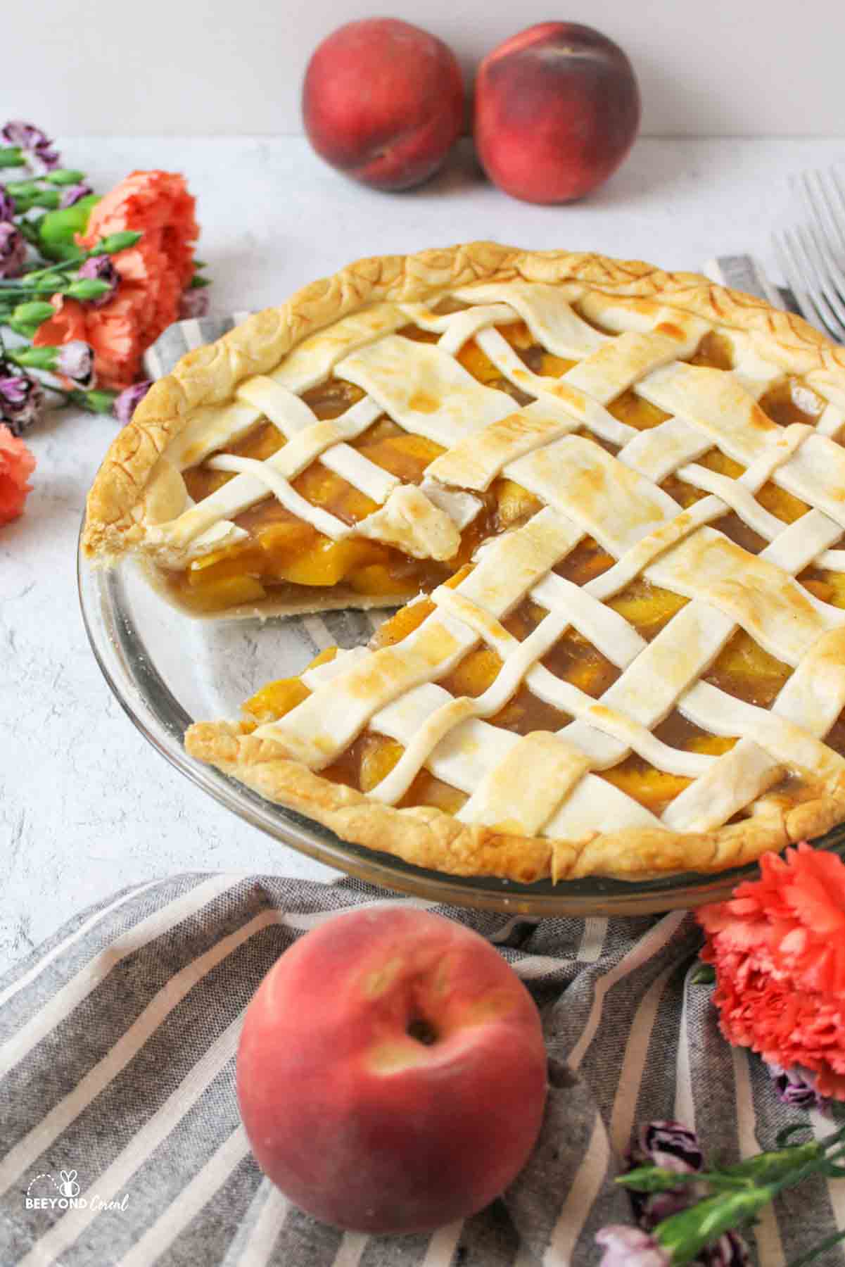 a peach pie missing a slice