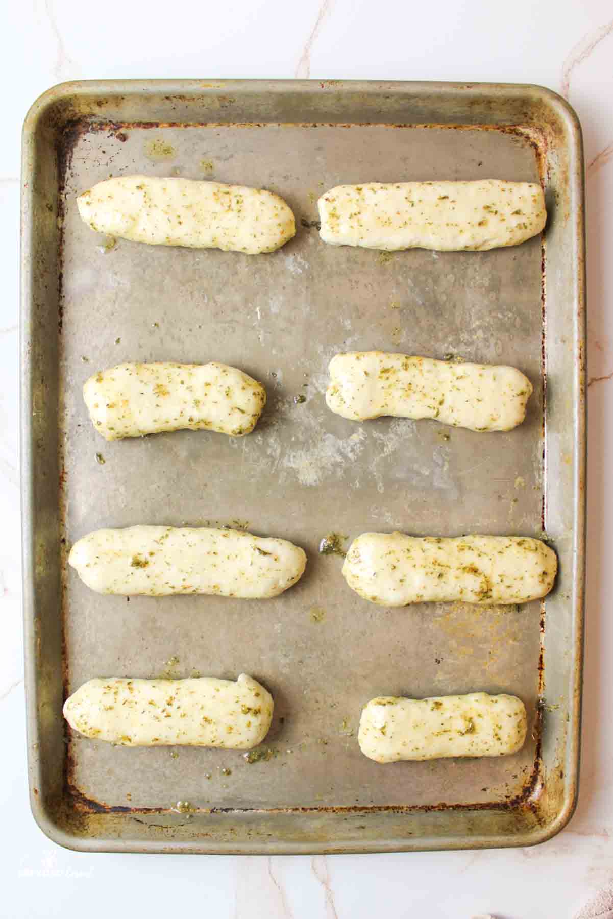 aerial view of pizza sticks on a baking sheet
