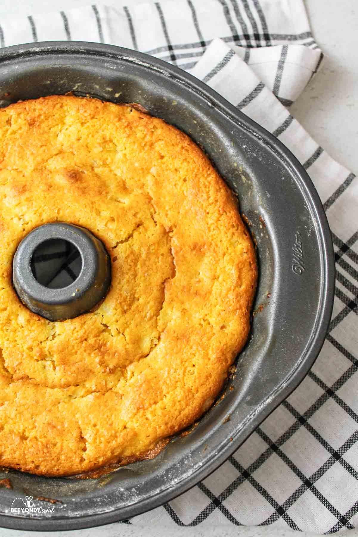 aerial view of a cooked cornbread bundt cake in the pan