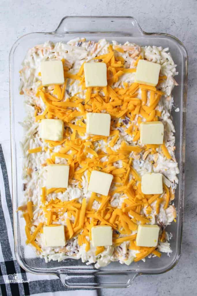 aerial view of unbaked hashbrown casserole in baking dish