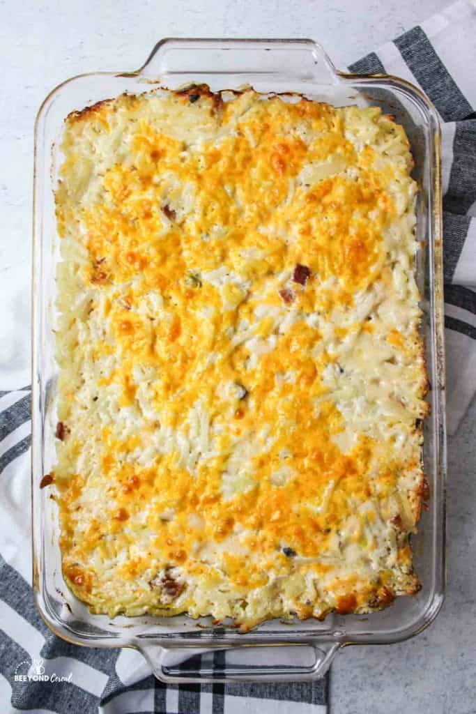 aerial view of baked hashbrown casserole in glass baking dish