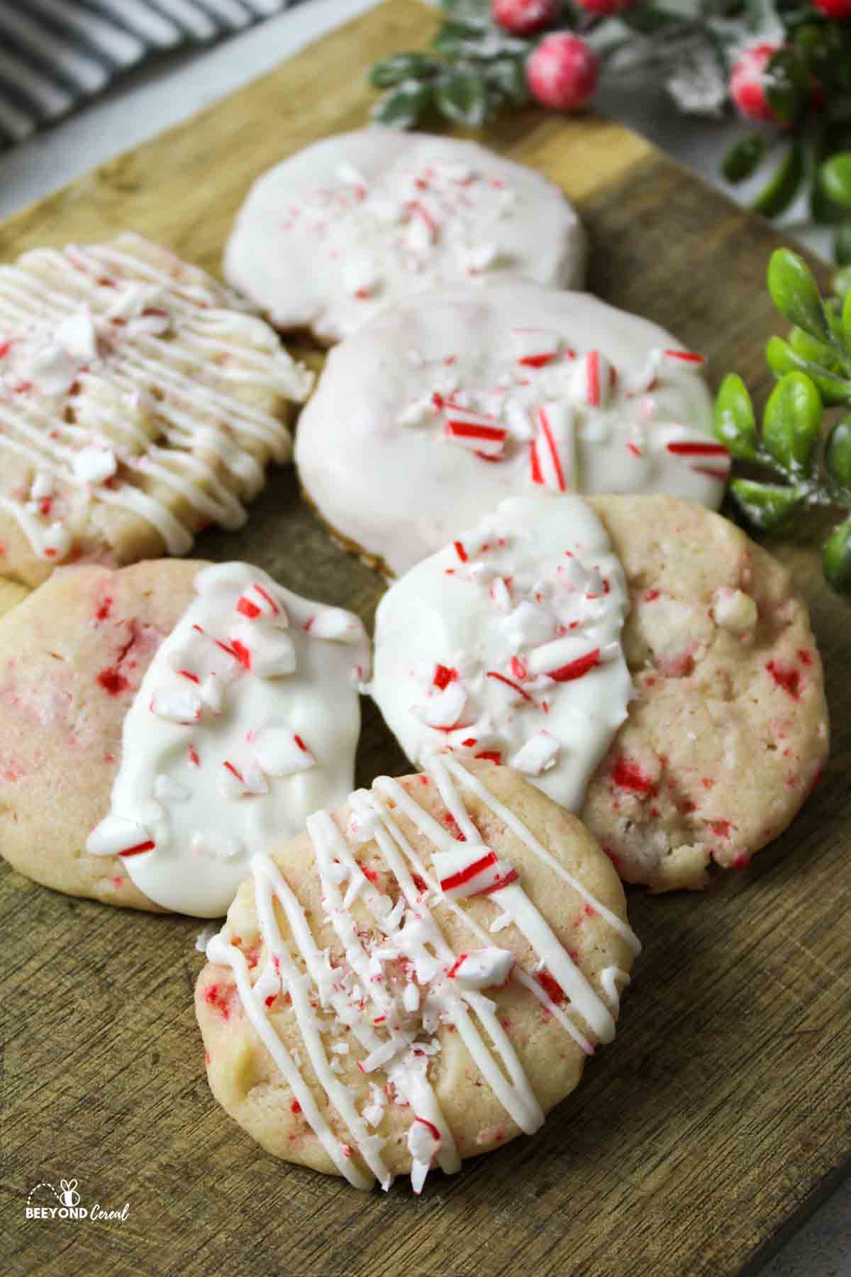 6 arranged peppermint shortbread cookies on a wooden surface