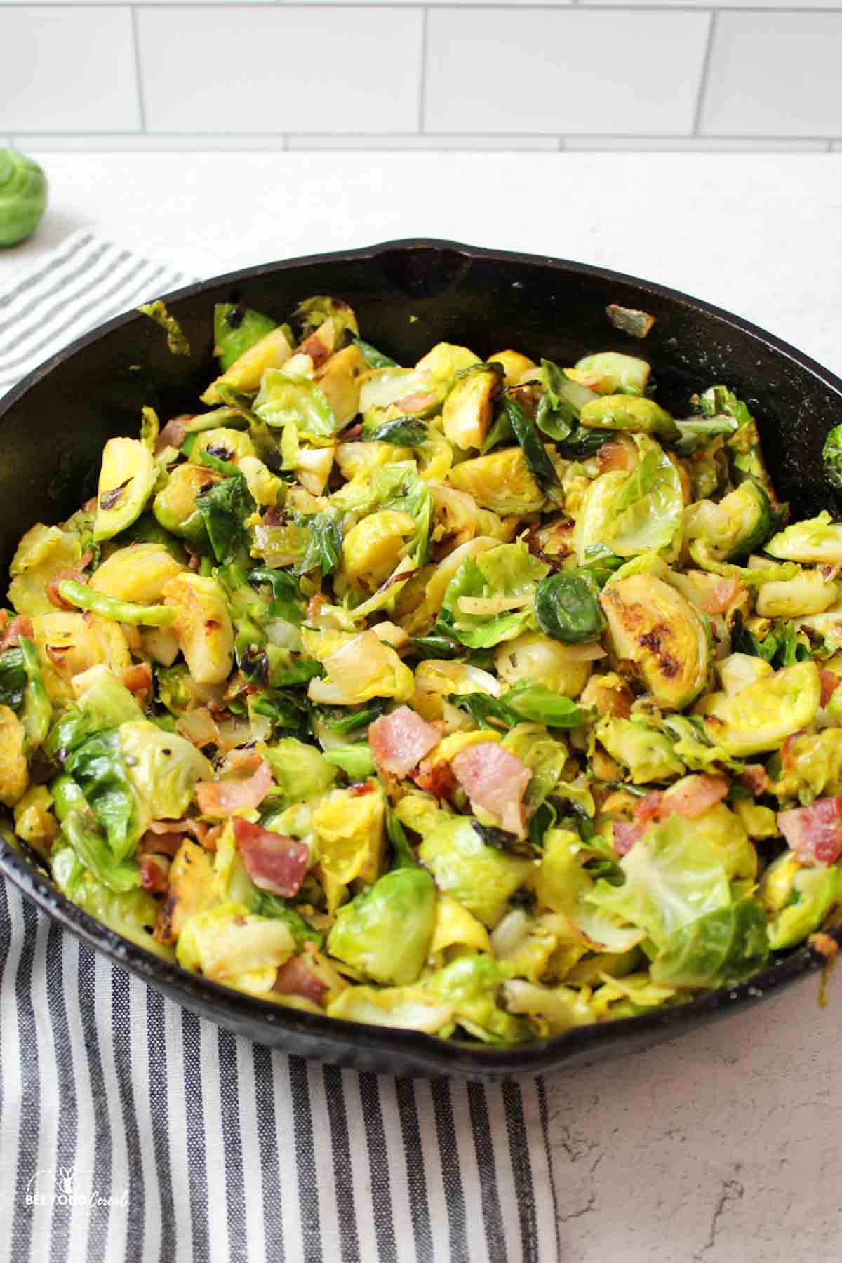 a cast iron skillet full of bacon ranch brussel sprouts