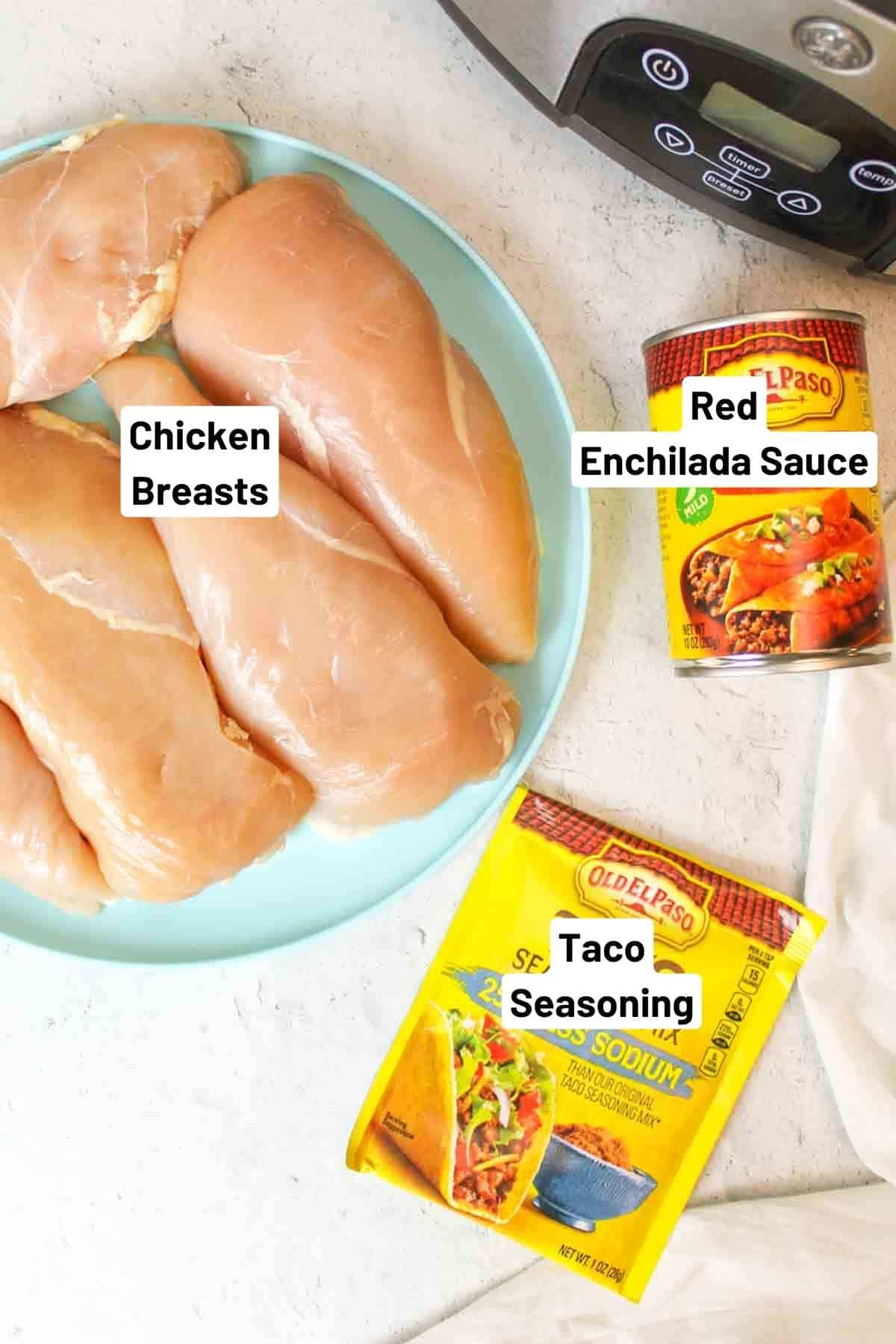 Enchilada sauce, taco seasoning, raw chicken breasts by crockpot.