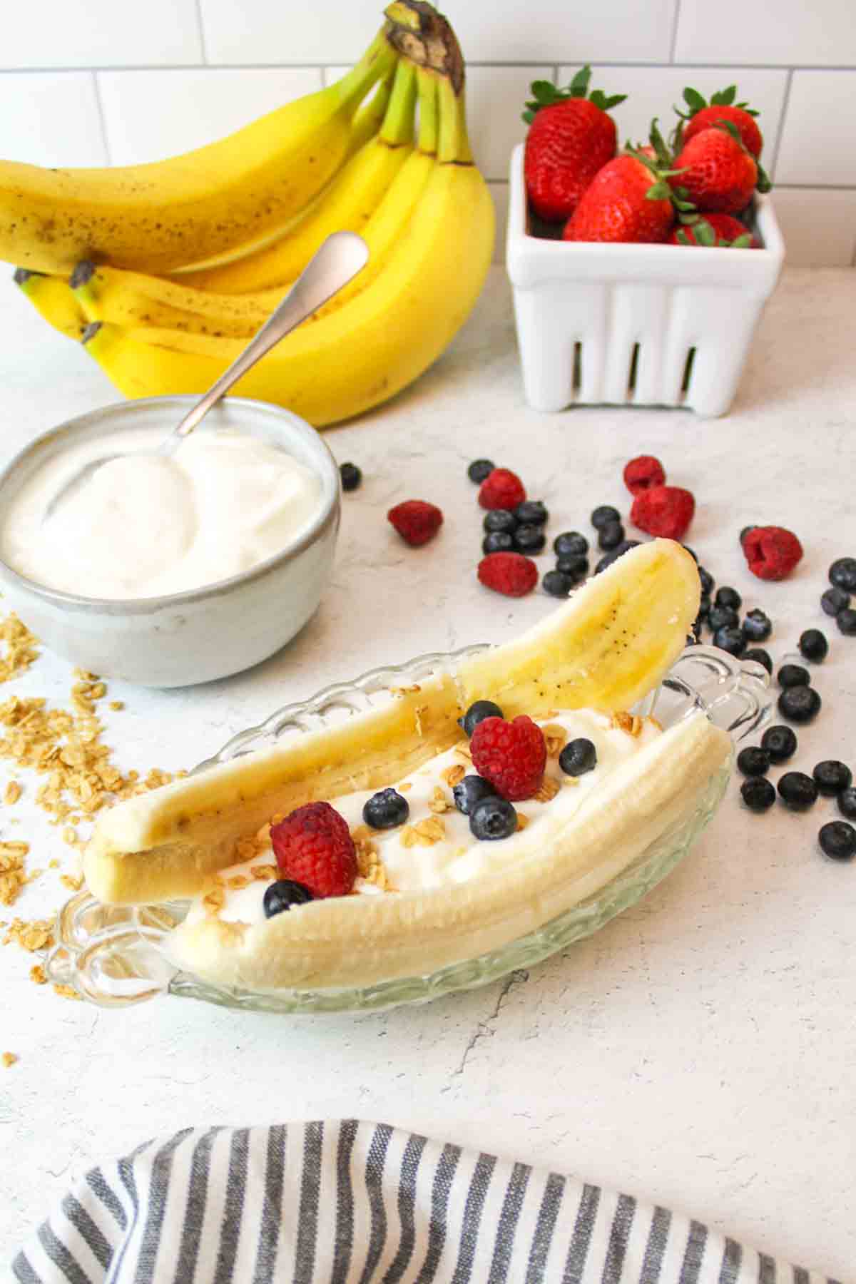 a healthy breakfast banana split in a bowl