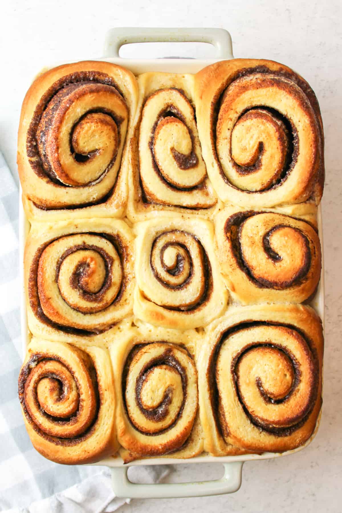 baked cinnamon rollls in a baking dish