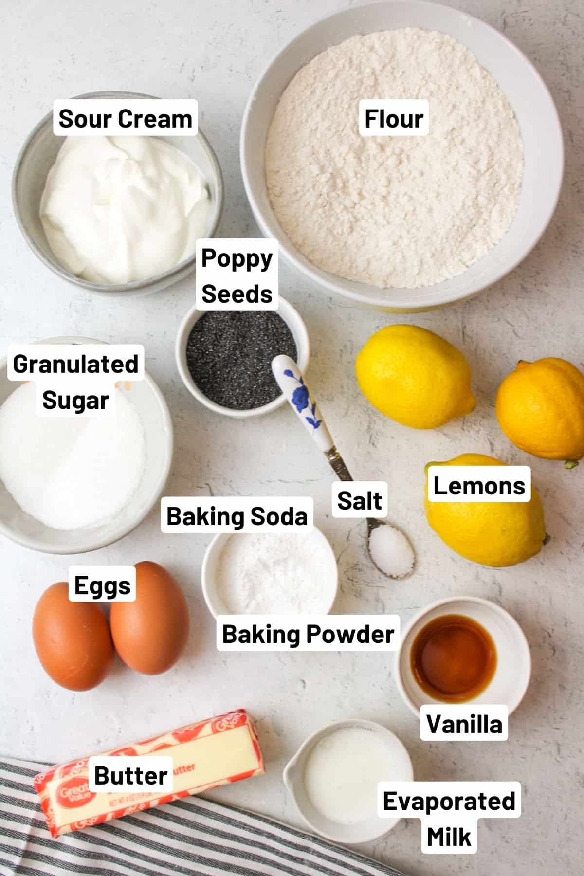 ingredients needed to make lemon poppy seed muffins.
