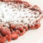 Funnel Cake topped with powdered sugar.