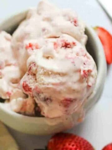 Strawberry ice cream in a bowl.