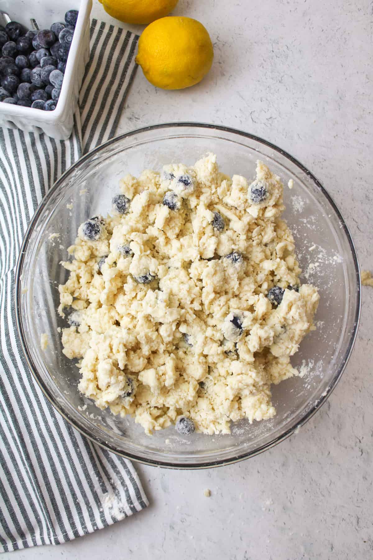 wet blueberry scone mixture in a mixing bowl