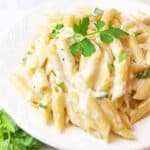 penne pasta with alfredo sauce and fresh parsley.