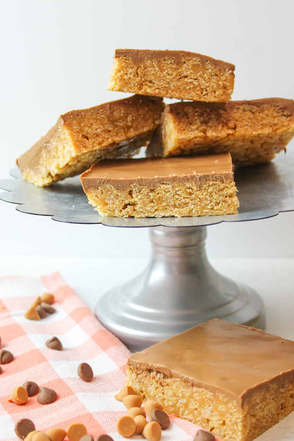 cut scotcheroo squares on and off of a metal cake stand.