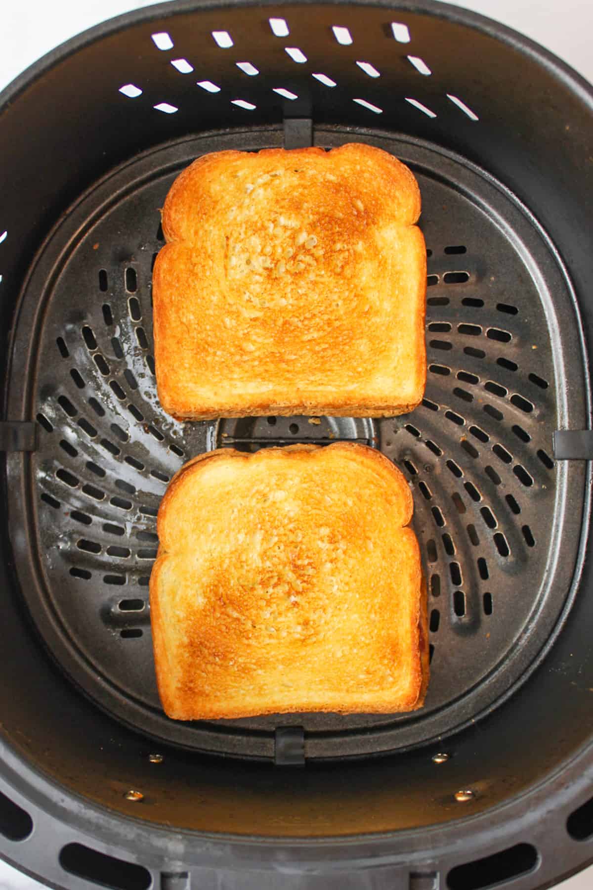 air fried peanut butter jelly sandwiches in air fryer basket