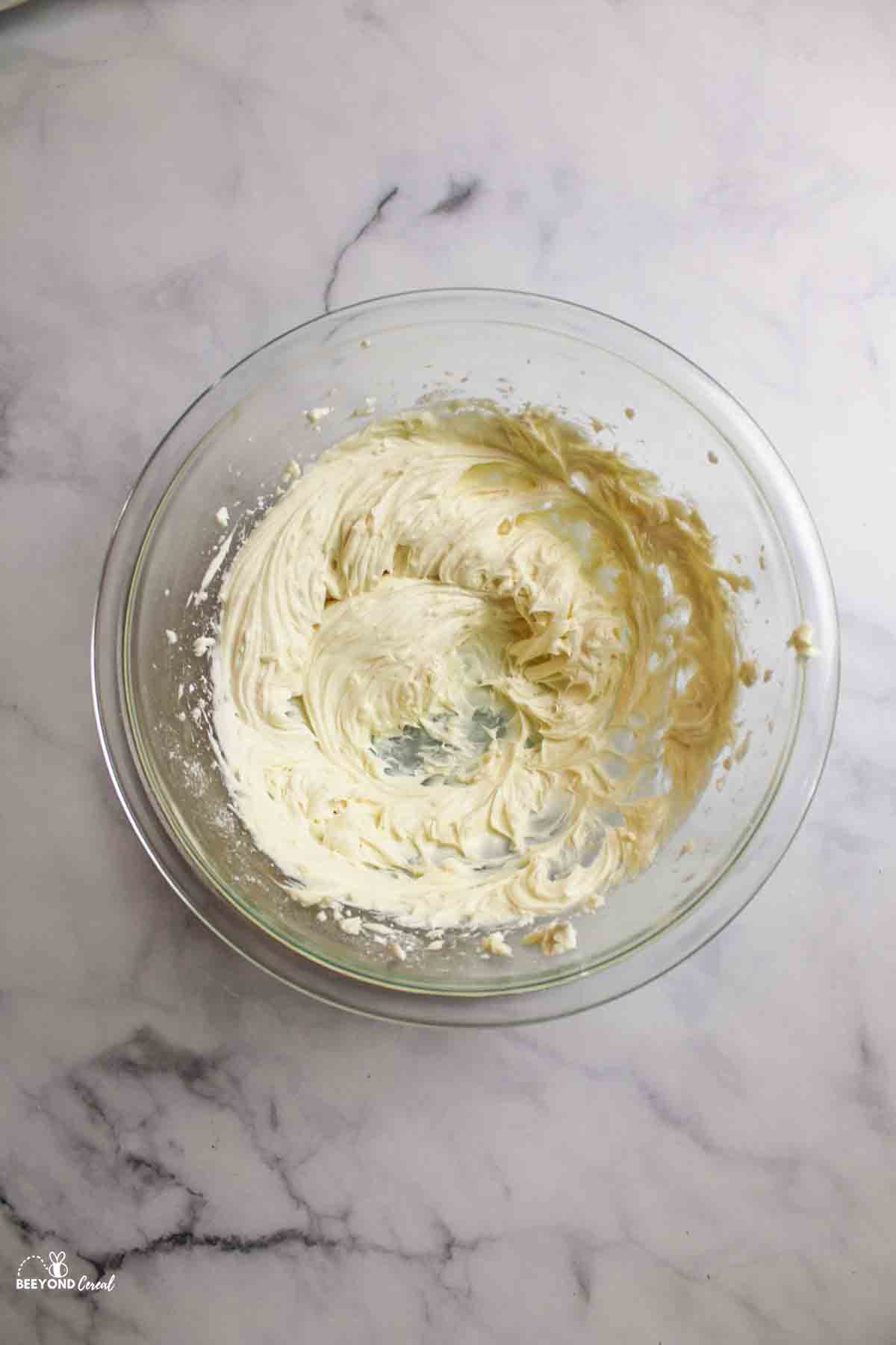 a bowl of cream cheese filling mixture.