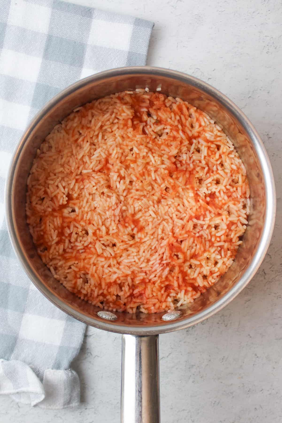 cooked salsa rice in a pot.