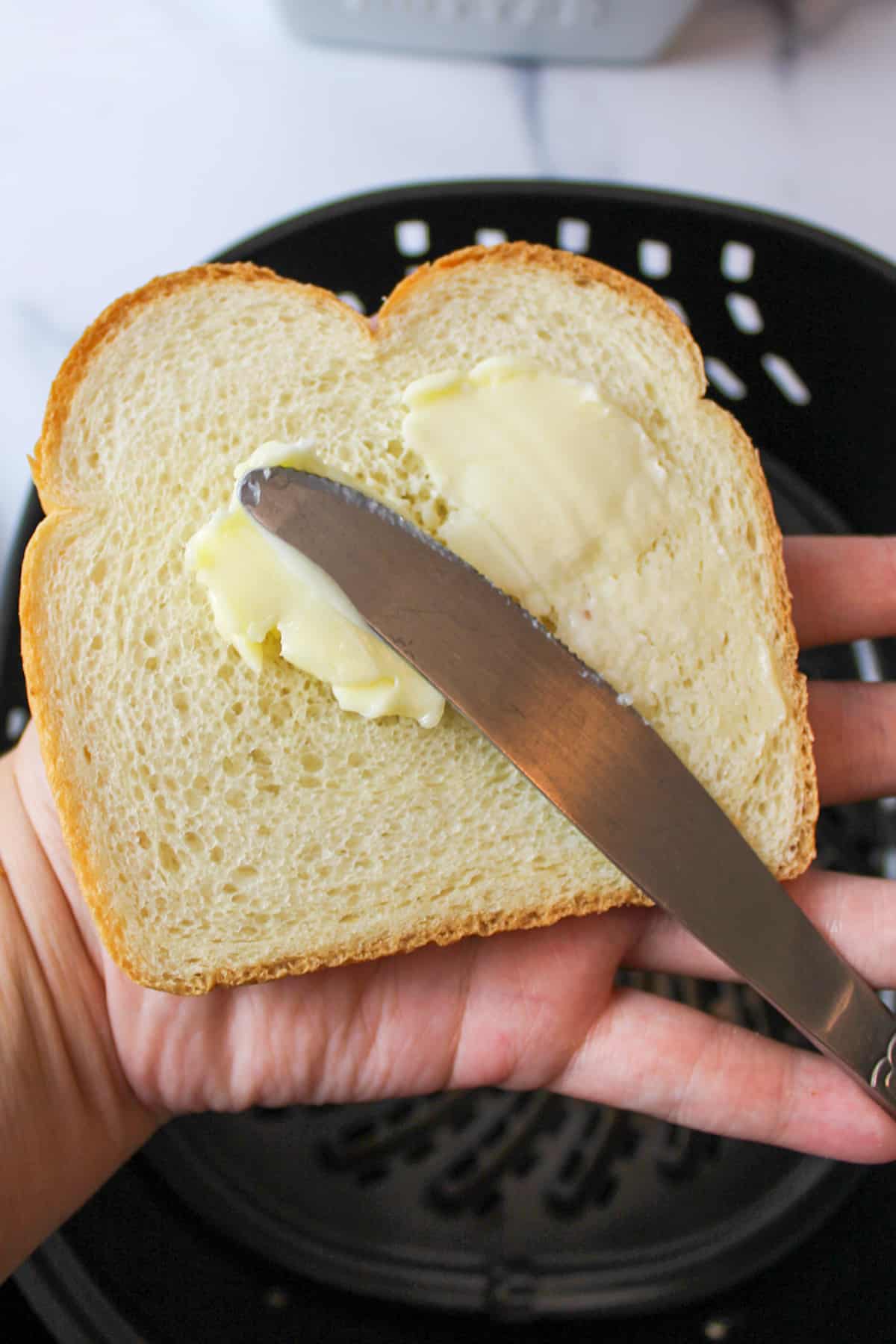 spreading butter on bread.