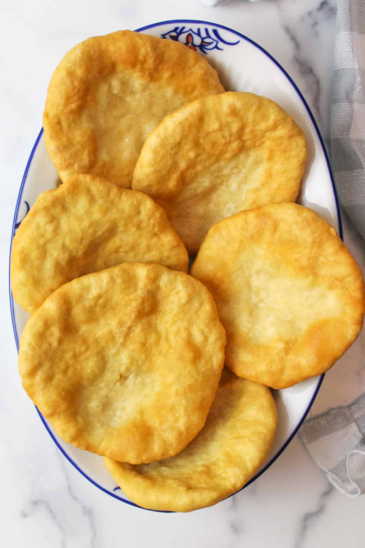 a dish filled with golden cooked fry bread.