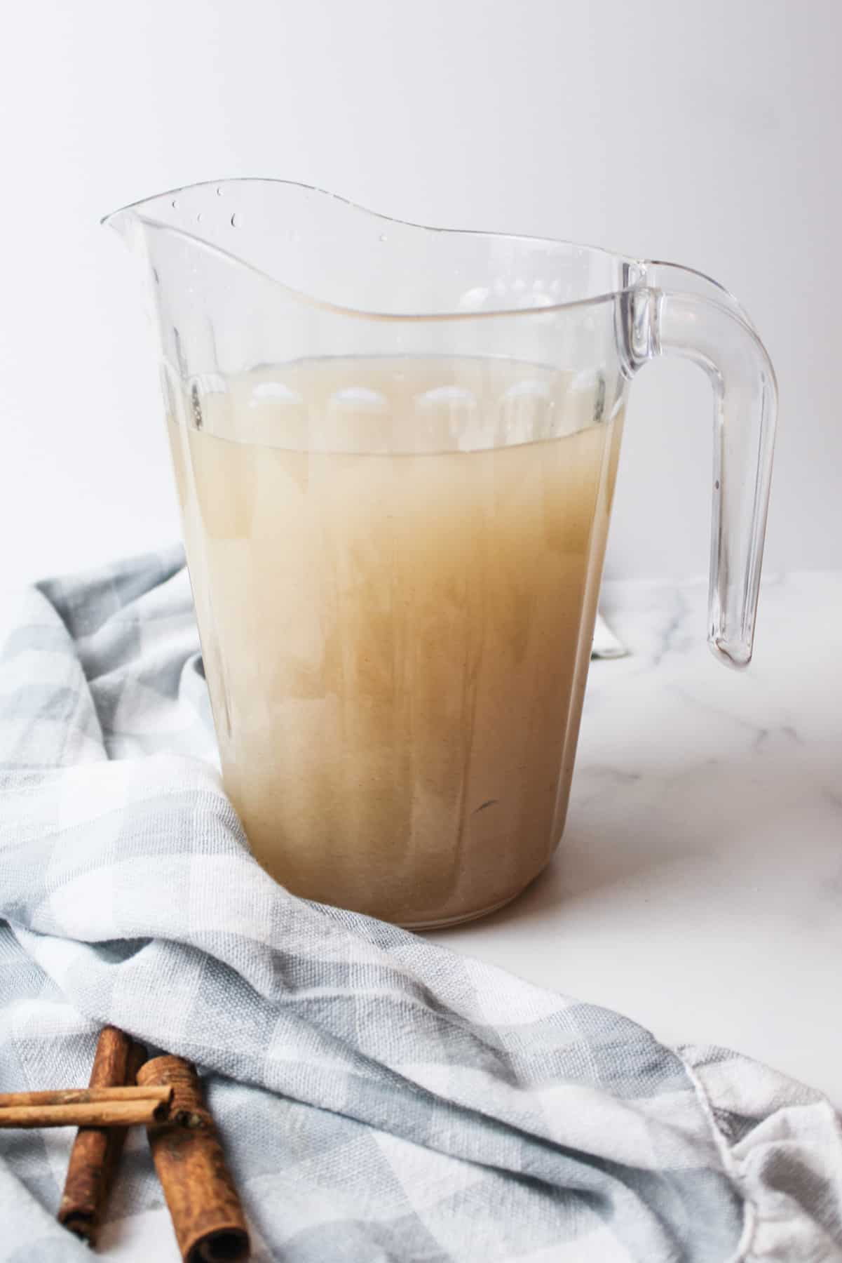 a pitcher full of cinnamon rice water.