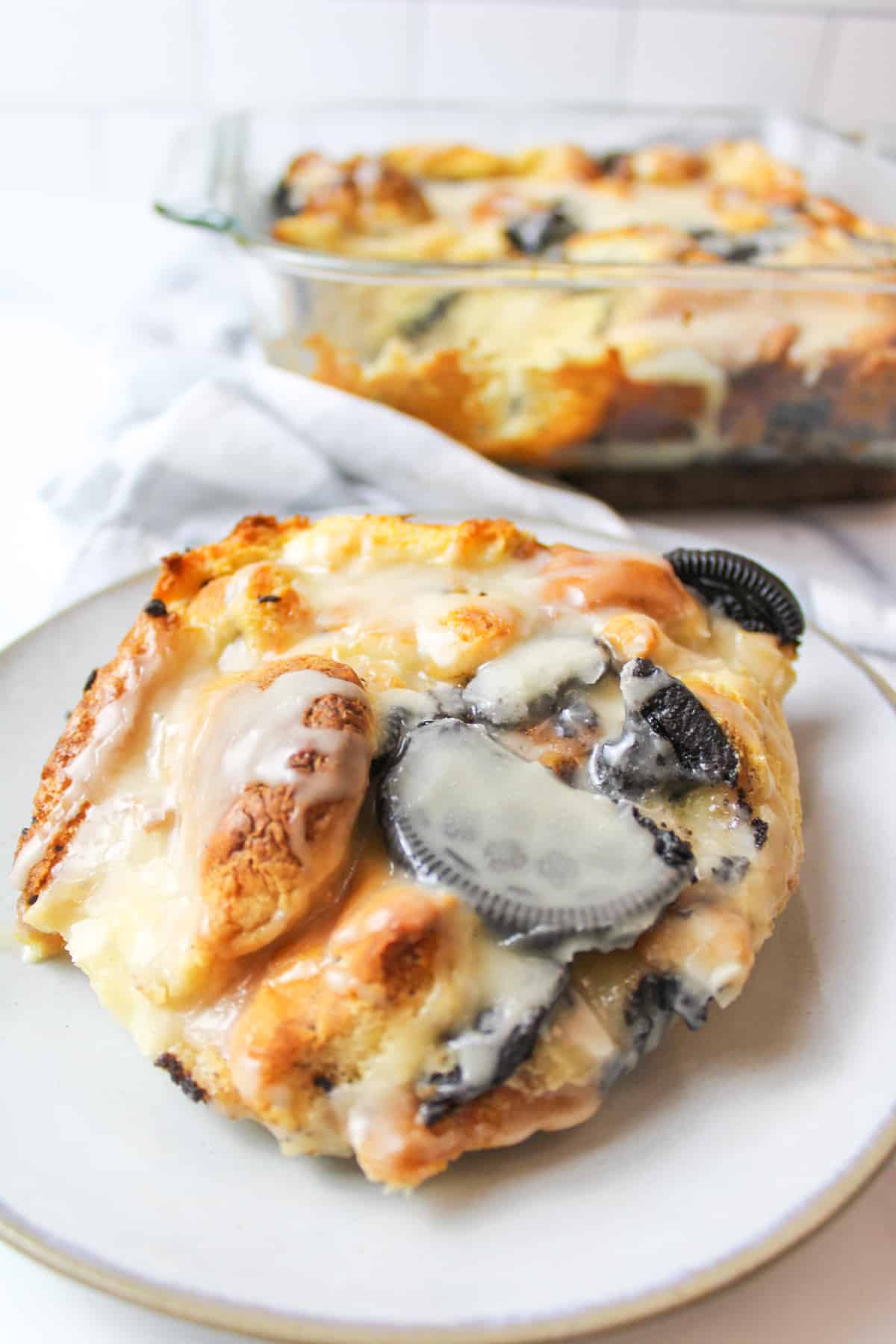 serving of oreo bread pudding on a plate.