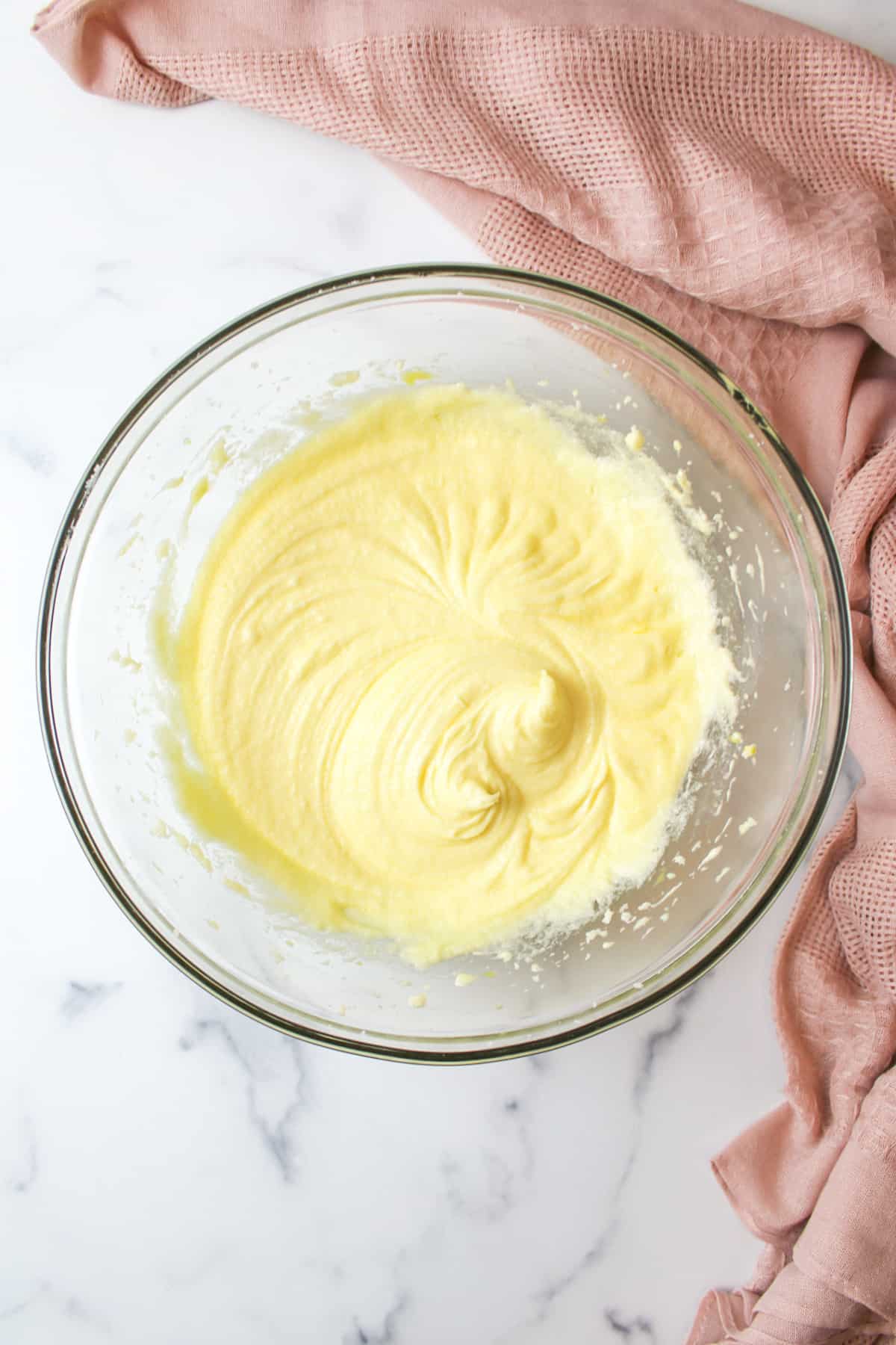 creamy egg and butter mixture in a mixing bowl
