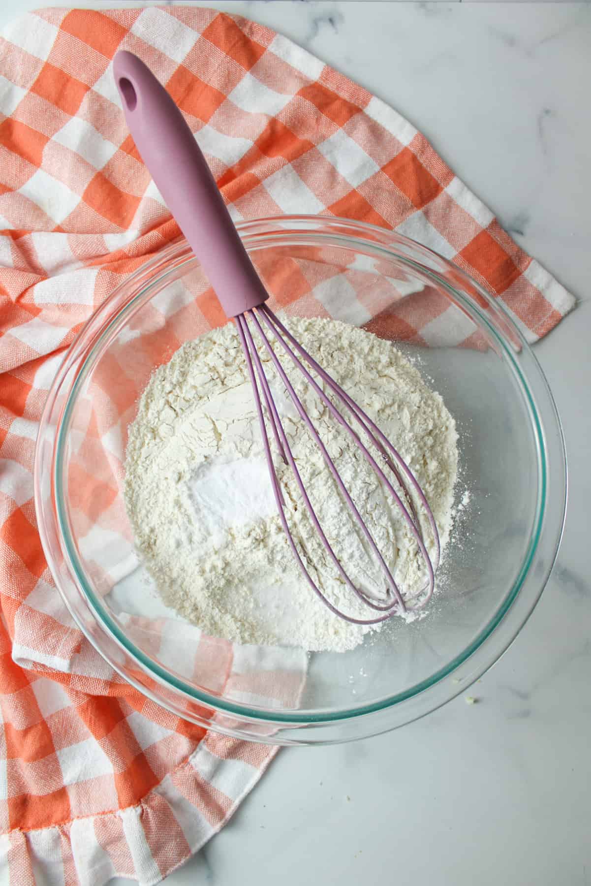 whisk in a bowl with dry ingredients