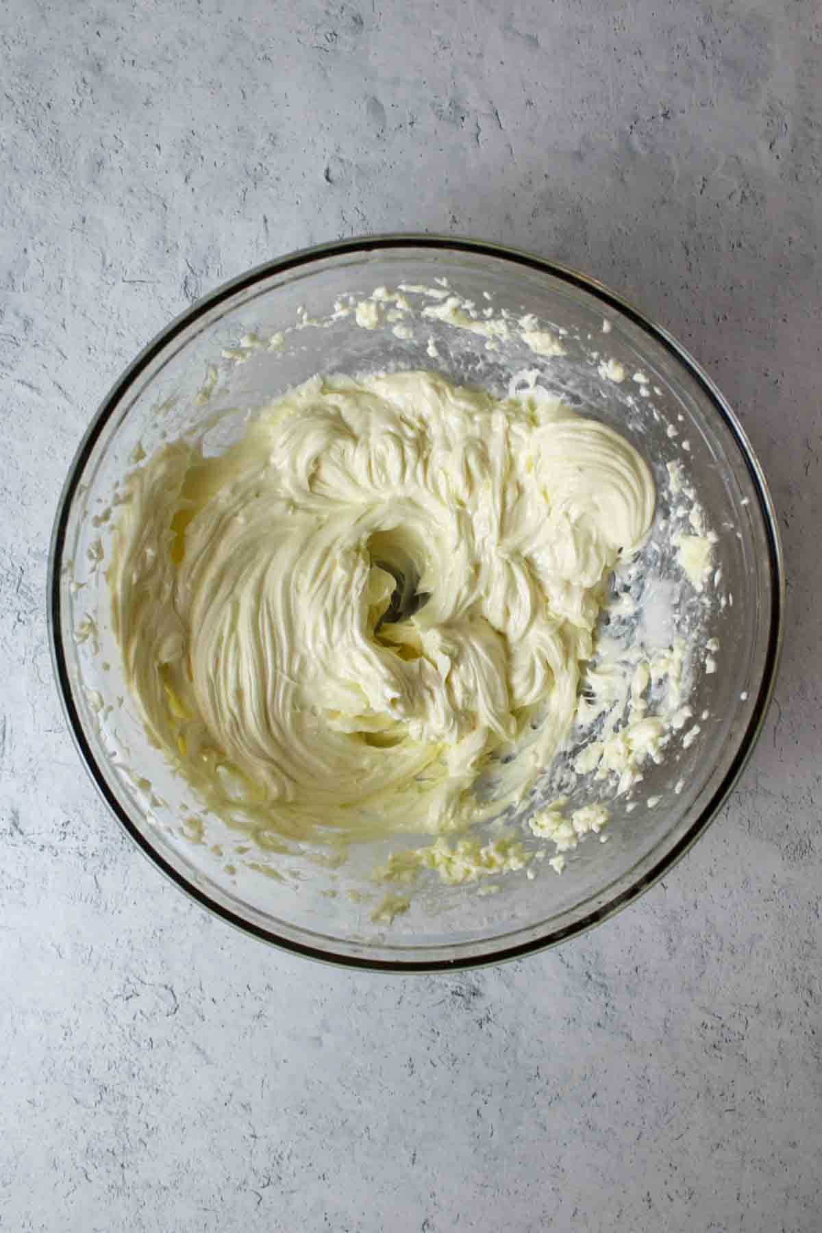 creamed butter and cream cheese in a mixing bowl.