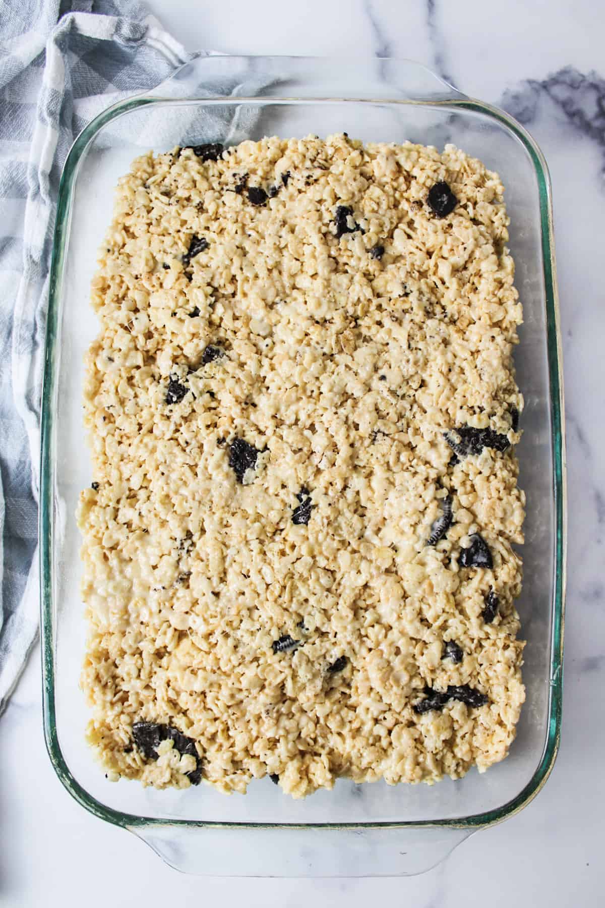 oreo rice krispie mixture pressed into a 9x13 greased baking dish.