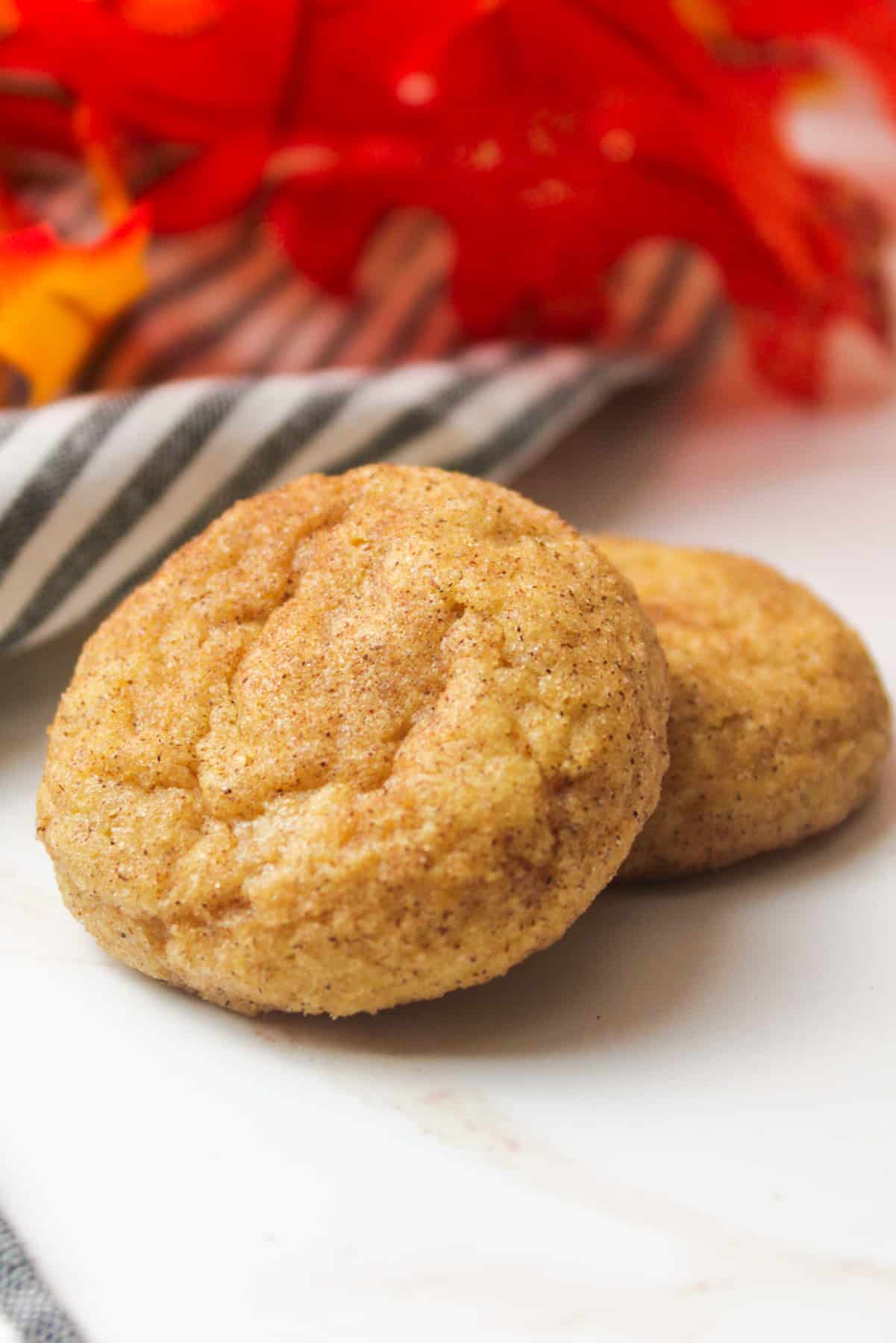 two stacked pumpkin spice snickerdoodle cookies.