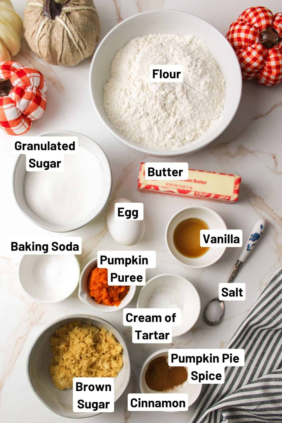 the ingredients needed to make pumpkin spice snickerdoodle cookies.