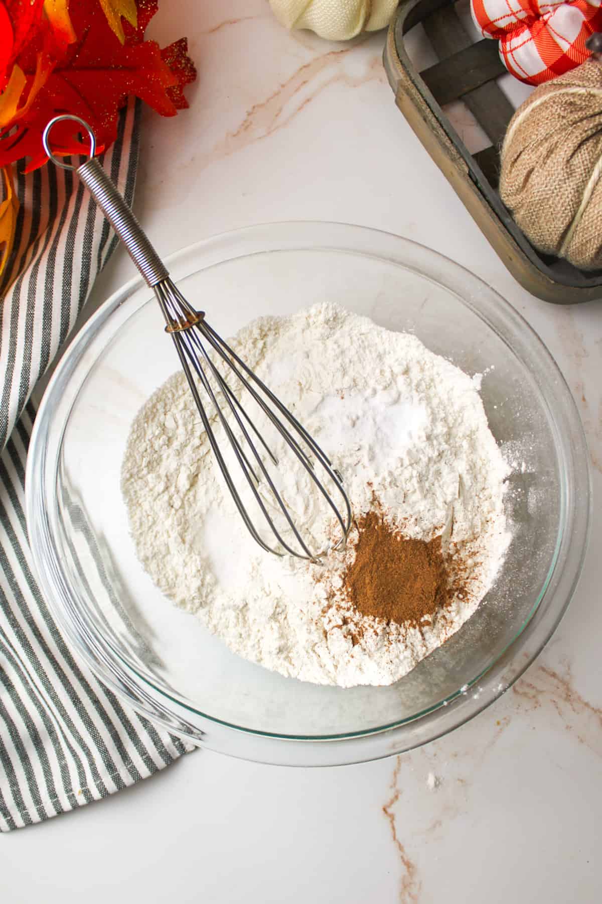 dry ingredients for cookies in a mixing bowl with a whisk
