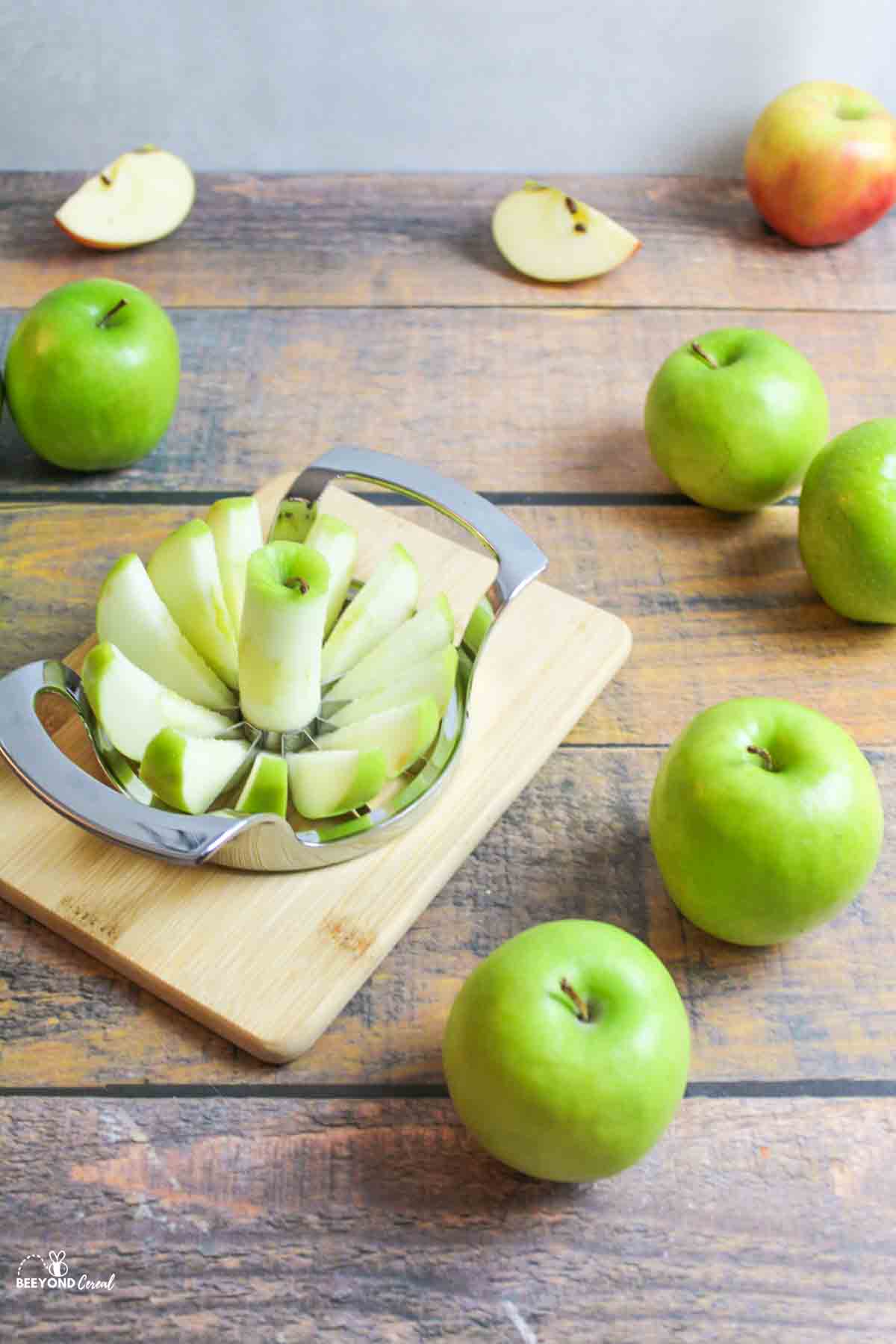 apple being sliced with metal apple cutter